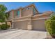 The exterior of the two-story home has a three-car garage and neutral color scheme at 3960 W Salter Dr, Glendale, AZ 85308