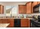 Bright kitchen showcasing granite countertops and sleek black appliances at 3960 W Salter Dr, Glendale, AZ 85308