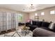 Cozy living room with dark sofa, decorative rug and a stylish round coffee table at 3960 W Salter Dr, Glendale, AZ 85308