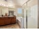 Serene primary bathroom with double sinks, a soaking tub, and a glass-enclosed shower at 3960 W Salter Dr, Glendale, AZ 85308