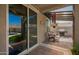 Covered patio with outdoor seating, grill and view of the sparkling swimming pool at 3960 W Salter Dr, Glendale, AZ 85308