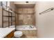 Bathroom featuring tile, a bathtub, and an overhead shower at 4420 E Covina St, Mesa, AZ 85205