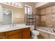 Bathroom featuring a tub with tile surround and a vanity sink at 4420 E Covina St, Mesa, AZ 85205