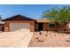 Charming single-story brick home with a well-kept yard and attached garage at 4420 E Covina St, Mesa, AZ 85205