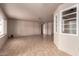 Open concept living area featuring neutral walls, tile flooring and natural lighting at 4420 E Covina St, Mesa, AZ 85205