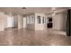 Spacious living area with tile floors and a large opening to another room at 4420 E Covina St, Mesa, AZ 85205
