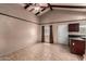 Cozy living room with beamed ceilings with view to kitchen at 4420 E Covina St, Mesa, AZ 85205