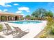 Relaxing community pool area with lounge chairs and shaded seating, perfect for sunny days at 4748 E Eden Dr, Cave Creek, AZ 85331