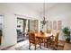 Bright dining area with a chandelier, and access to an outdoor patio and creating a perfect ambiance for gatherings at 4748 E Eden Dr, Cave Creek, AZ 85331
