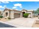 Charming single-story home with a well-maintained front yard, two car garage and inviting curb appeal on a sunny day at 4748 E Eden Dr, Cave Creek, AZ 85331