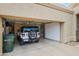 Open garage with a Jeep parked inside features built-in storage cabinets and ample room for parking at 4748 E Eden Dr, Cave Creek, AZ 85331