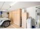 Spacious garage with built-in storage cabinets and a utility sink offers ample space for parking and projects at 4748 E Eden Dr, Cave Creek, AZ 85331