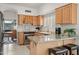 Efficient kitchen with light wood cabinets, granite countertops, stainless steel appliances and natural light for a functional space at 4748 E Eden Dr, Cave Creek, AZ 85331