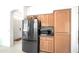 Kitchen featuring a stainless-steel refrigerator, abundant cabinetry, and neutral countertops, providing ample storage and functionality at 4748 E Eden Dr, Cave Creek, AZ 85331