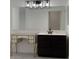 Bathroom featuring double vanity and modern lighting fixtures at 525 N Miller Rd # 239, Scottsdale, AZ 85257