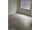 Empty bedroom featuring tile flooring and bright natural light from the window at 525 N Miller Rd # 239, Scottsdale, AZ 85257