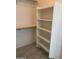 Closet featuring built in shelves and clothing racks at 525 N Miller Rd # 239, Scottsdale, AZ 85257