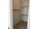 Walk in closet featuring built in shelving and wood closet rods at 525 N Miller Rd # 239, Scottsdale, AZ 85257