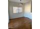 Dining room with natural light, wood flooring, and door at 525 N Miller Rd # 239, Scottsdale, AZ 85257