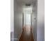 Hallway with white walls and hardwood floors at 525 N Miller Rd # 239, Scottsdale, AZ 85257