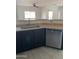 Kitchen with stainless steel dishwasher and sink with breakfast bar to living area at 525 N Miller Rd # 239, Scottsdale, AZ 85257