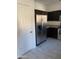 Kitchen features a stainless steel refrigerator and dark wood cabinetry at 525 N Miller Rd # 239, Scottsdale, AZ 85257