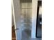 Pantry with ample shelving and access to the kitchen at 525 N Miller Rd # 239, Scottsdale, AZ 85257