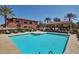 Inviting community pool with lounge chairs and a covered cabana, perfect for relaxation and enjoyment at 525 N Miller Rd # 239, Scottsdale, AZ 85257