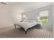 Bright bedroom with carpet floors, two windows, and soft, neutral tones at 652 E Rojo Way, Gilbert, AZ 85297