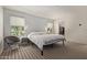 Airy bedroom with carpet floors, large windows, and soft, neutral tones at 652 E Rojo Way, Gilbert, AZ 85297