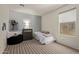 Cozy bedroom with neutral decor featuring a single bed, and chest of drawers at 652 E Rojo Way, Gilbert, AZ 85297
