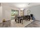 Cozy dining room with stylish light fixture, and a sliding glass door to the backyard at 652 E Rojo Way, Gilbert, AZ 85297