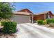 Single-story home featuring a 2-car garage, neutral color palette and tidy landscape in front at 652 E Rojo Way, Gilbert, AZ 85297