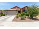 Charming single-story home with a well-maintained front yard and attached two-car garage at 652 E Rojo Way, Gilbert, AZ 85297