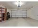 Spacious two-car garage with epoxy flooring and overhead door at 652 E Rojo Way, Gilbert, AZ 85297