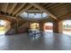 Interior of a stone and concrete gazebo with picnic tables at 652 E Rojo Way, Gilbert, AZ 85297