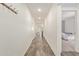 Hallway with hardwood-style flooring leading to living area and bedroom at 652 E Rojo Way, Gilbert, AZ 85297