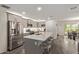 Modern kitchen boasts stainless steel appliances, ample counter space, and a large island with seating at 652 E Rojo Way, Gilbert, AZ 85297