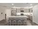 Bright, updated kitchen with a large central island and stainless-steel appliances offers lots of room at 652 E Rojo Way, Gilbert, AZ 85297