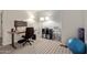 Home office with a standing desk, floor lamp, shelving, and an exercise ball at 652 E Rojo Way, Gilbert, AZ 85297