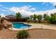 Inviting backyard pool, with landscaping, is a highlight of this property at 6637 W Watkins St, Phoenix, AZ 85043