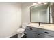 Powder bath featuring a vanity with gray cabinets and a modern sink at 6637 W Watkins St, Phoenix, AZ 85043