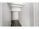 Walk in closet with wood floors and hanging rod at 6637 W Watkins St, Phoenix, AZ 85043
