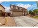 Charming two-story home with a two-car garage, a side fence, and low-maintenance landscaping at 6637 W Watkins St, Phoenix, AZ 85043
