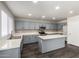 Bright kitchen boasting stainless appliances, gray cabinets, and a center island at 6637 W Watkins St, Phoenix, AZ 85043