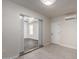 Bright living room features modern finishes, light tile flooring, and an open doorway to another room at 6637 W Watkins St, Phoenix, AZ 85043