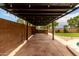 Built-in barbecue area with an outdoor kitchen with an elongated countertop and bar at 6637 W Watkins St, Phoenix, AZ 85043