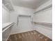 Spacious walk-in closet with multiple shelves and hanging rods at 6637 W Watkins St, Phoenix, AZ 85043