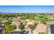 Aerial view of homes along the golf course with mountain views captures the peaceful community at 6847 S 27Th Pl, Phoenix, AZ 85042