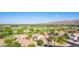 Panoramic aerial of a neighborhood with a golf course and mountain views provides a glimpse of community at 6847 S 27Th Pl, Phoenix, AZ 85042